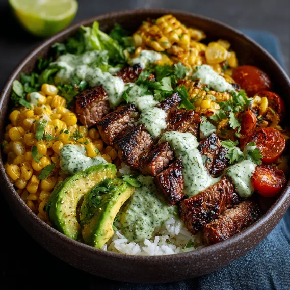 A bowl of food with steak, avocado, and roasted corn.