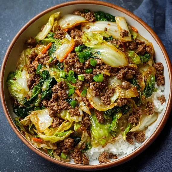 A bowl of Chinese ground beef and cabbage stir-fry.