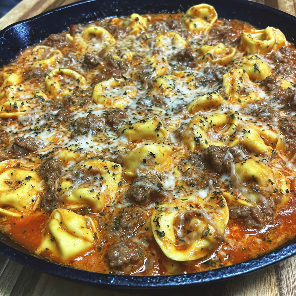 A pan of creamy Italian sausage tortellini.