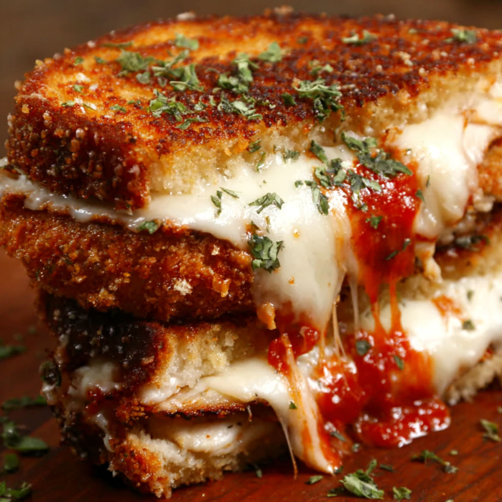 A grilled cheese sandwich with chicken Parmesan.