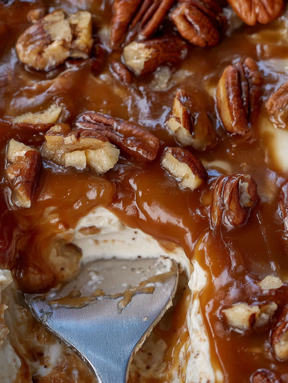 A close up of a delicious dessert with pecans and caramel.