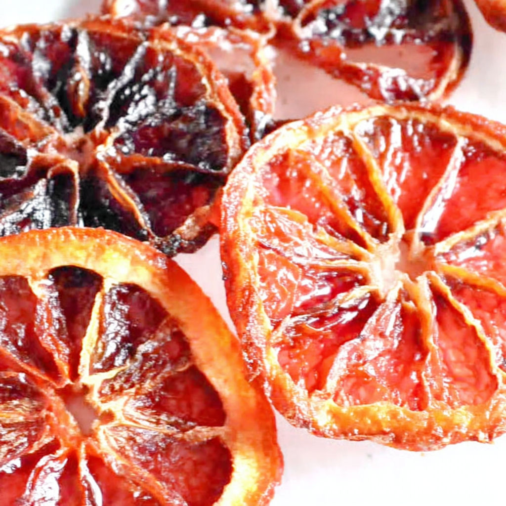 A close up of candied citrus fruit.