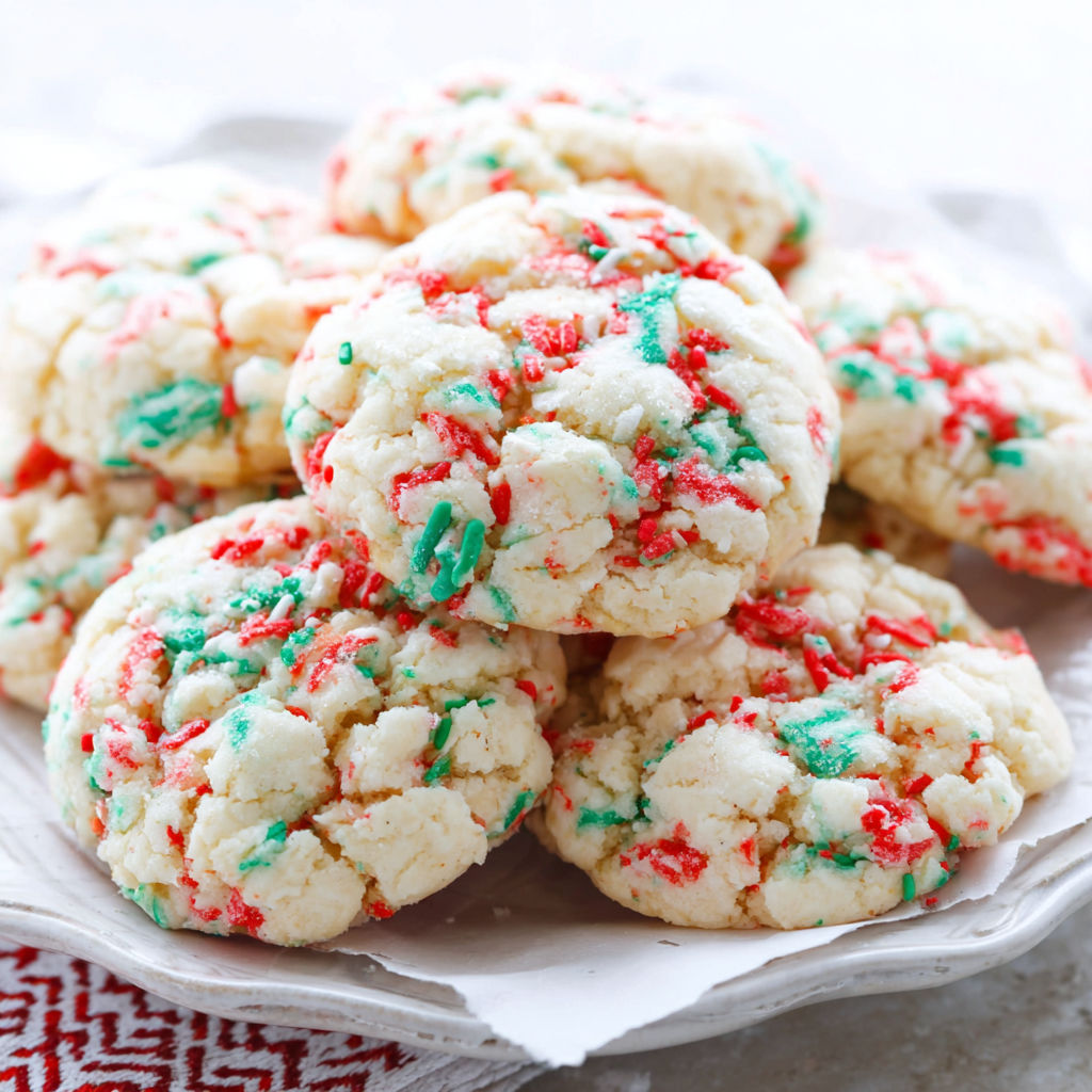 A plate of cookies with red, green and white colors.