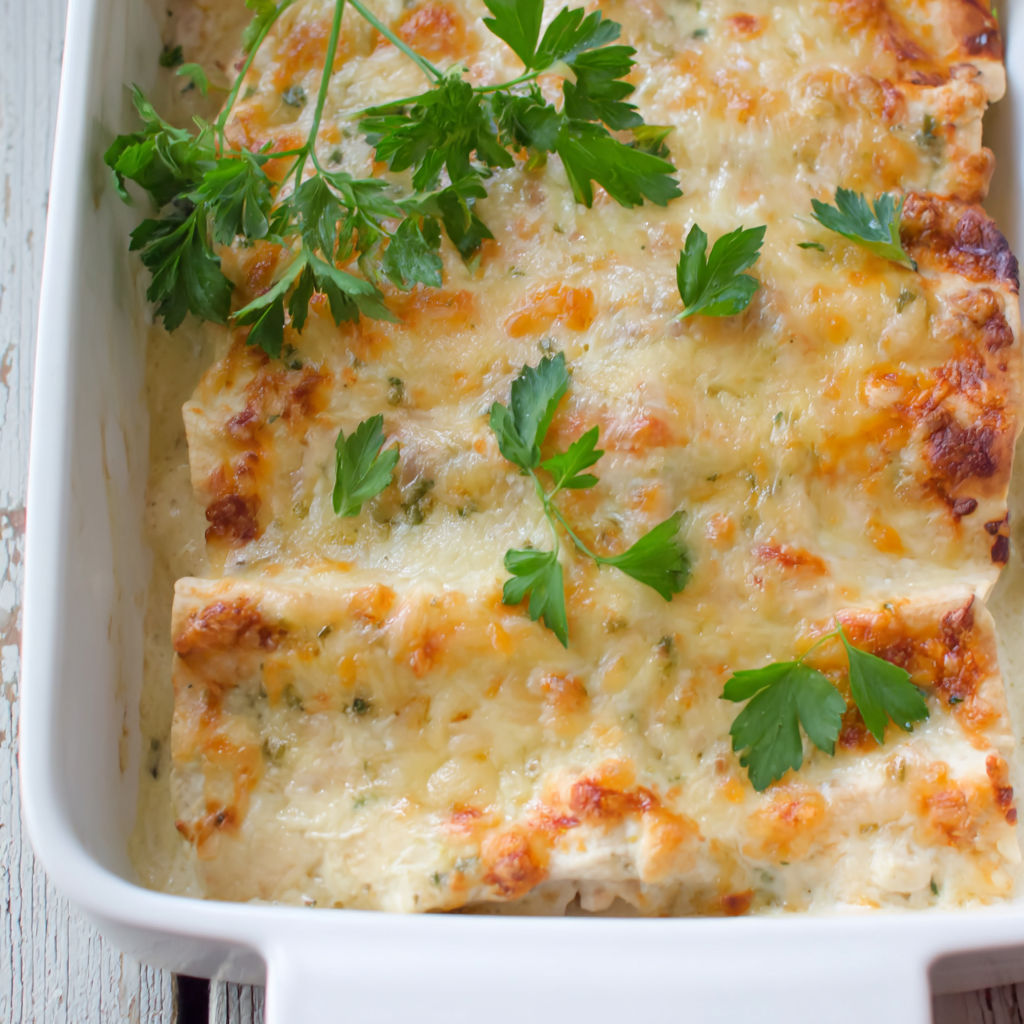 A dish of Skinny White Chicken Enchiladas.