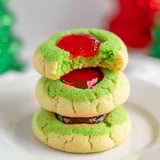 Grinch style thumbprint cookies with red jam.