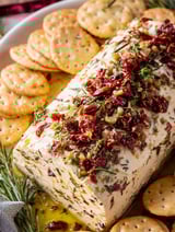 A loaf of Italian cheese is displayed on a table.