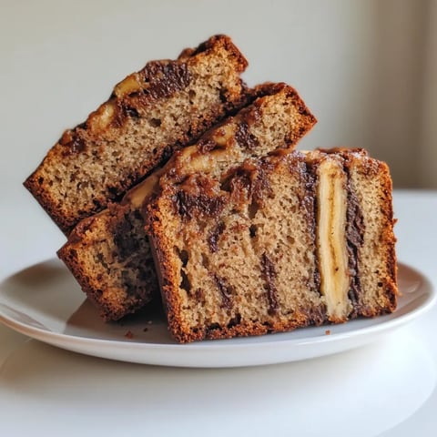A slice of banana bread with chocolate chips.