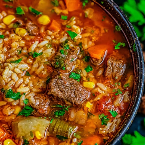 A bowl of Mexican beef and rice soup.