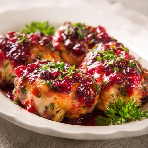 A plate of Cranberry Orange Glazed Chicken.