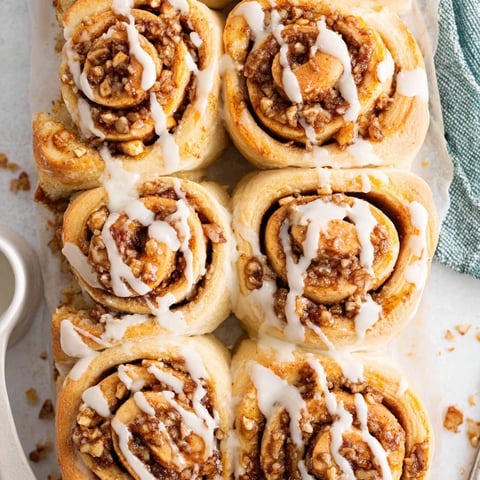 A tray of baked apple cinnamon rolls.