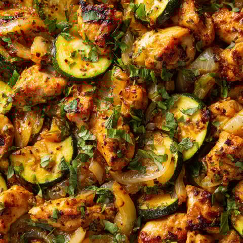 A delicious meal of chicken and zucchini.