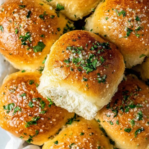 A close up of garlic bread rolls.