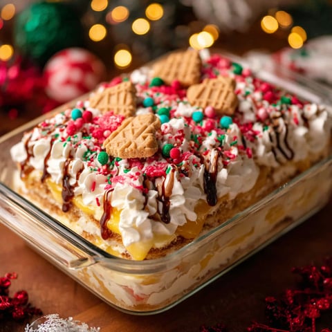 A Christmas Cookie Lasagna is displayed in a glass dish.