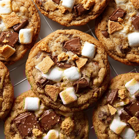 A plate of cookies with marshmallows on top.